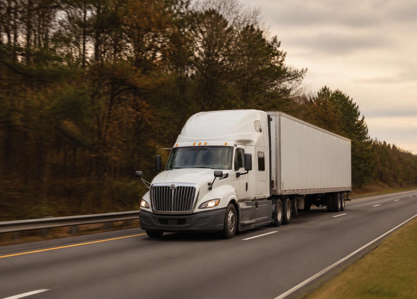 A commercial truck traveling an interstate highway in the Southeast